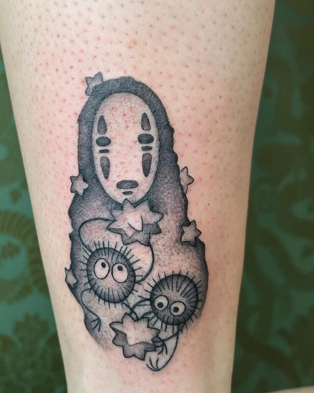 Stippled tattoo of No-Face from Spirited Away with two soot sprites and star shapes